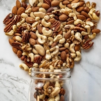 Raw Mixed Nuts Natural Mixed Nuts is a great healthy snack. This mix includes jumbo cashews, almonds, pecans, walnuts, filberts, and brazil nuts. All these nuts are packed with nutrients, healthy fats, proteins, and are all natural. 14 oz bag. </p> <p></p> <p>This product is Gluten Free*</p> <p>**Allergy Info:  Packaged in a facility that processes Peanuts, Treenuts (Including Cashews, Almonds, Hazelnuts), Milk, Soy, Egg, and Wheat.</p>